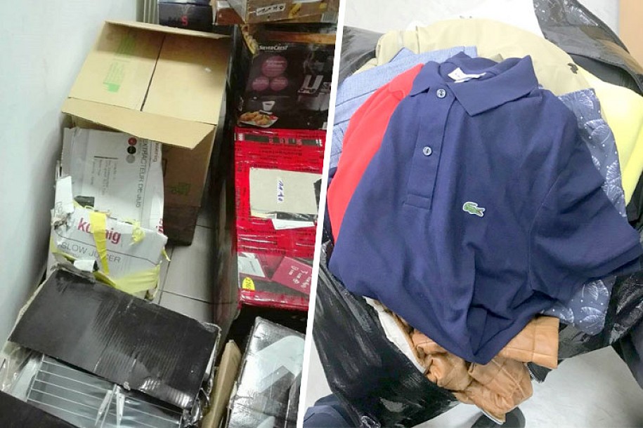 Zaplenjena veća količina firmirane garderobe, električnih aparata i alata